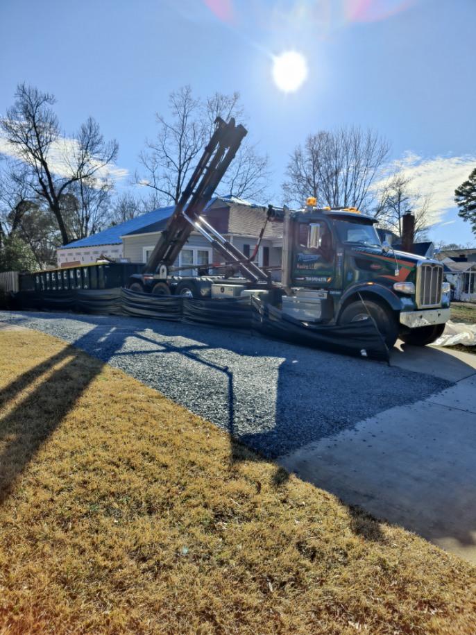 Dumpster delivery truck servicing Charlotte NC